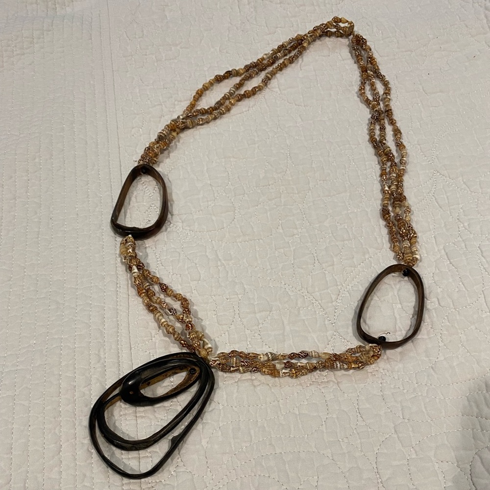 Unique shell and deer antler necklace.